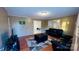 Cozy living room featuring hardwood floors, neutral walls, and a view into the next room at 124 Riley Rd, Dallas, NC 28034