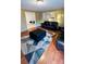 This living room features wood floors, neutral walls, and a dark leather furniture set at 124 Riley Rd, Dallas, NC 28034