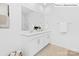 Bright bathroom featuring dual sinks, white cabinets, a large mirror, and a separate glass-enclosed shower at 1324 Secrest Commons Dr, Monroe, NC 28112
