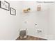 Practical laundry room with shelving, washer hookups, and space for storage at 1324 Secrest Commons Dr, Monroe, NC 28112