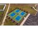 Overhead view of community's four pickleball courts, showing green courts with blue boxes at 1324 Secrest Commons Dr, Monroe, NC 28112