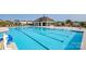 A large community pool with ample lounge seating and a pool house at 1324 Secrest Commons Dr, Monroe, NC 28112