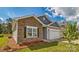 Charming home featuring stone accents, a two-car garage, and professional landscaping at 1328 Secrest Commons Dr, Monroe, NC 28112