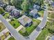 Aerial view showcases a home surrounded by lush greenery and manicured lawns in a peaceful neighborhood at 133 Misty Woods Dr, Lake Wylie, SC 29710