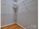Walk-in closet with adjustable wire shelving and hanging racks at 133 Misty Woods Dr, Lake Wylie, SC 29710