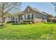 A beautiful brick home with a lush green lawn and lovely front yard landscaping at 133 Misty Woods Dr, Lake Wylie, SC 29710