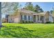 Charming brick home with a well-manicured lawn and complementary landscaping at 133 Misty Woods Dr, Lake Wylie, SC 29710