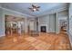 Open-concept living area with hardwood flooring, a fireplace, and access to other rooms at 133 Misty Woods Dr, Lake Wylie, SC 29710