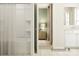 Bright bathroom with a shower/tub combo and neutral tile, and a glimpse of the bedroom through an open door at 1552 Croydon St, Indian Land, SC 29707