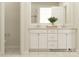 Elegant bathroom with a double sink vanity, a large mirror, and a glimpse into the shower area at 1552 Croydon St, Indian Land, SC 29707
