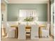 Elegant dining room with a wooden table, white chairs, modern lighting, and neutral decor at 1552 Croydon St, Indian Land, SC 29707