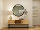 Bright entryway featuring wood floors, decorative mirror, console table, table lamp, and artistic decor at 1552 Croydon St, Indian Land, SC 29707