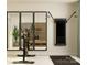 Modern exercise area with cycling machine and sleek wall-mounted equipment, reflected in large mirrors at 1552 Croydon St, Indian Land, SC 29707