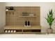 Home gym showcases a storage unit with fitness accessories and a slatted wall, blending style and functionality at 1552 Croydon St, Indian Land, SC 29707