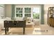 Inviting living room features a large window, a sectional sofa, and a foosball table for entertainment at 1552 Croydon St, Indian Land, SC 29707