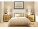 Comfortable main bedroom featuring a large bed with decorative pillows and stylish bedside tables with lamps at 1552 Croydon St, Indian Land, SC 29707