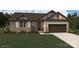 Charming single-story home with stone accents, well-maintained lawn, and a two-car garage at 1619 Honey Trl, Monroe, NC 28112