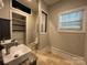 Bright bathroom featuring dual sinks, walk-in shower, and neutral finishes at 179 Tomahawk Ln, Mount Gilead, NC 27371