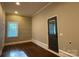 Bedroom featuring wood floors, accent wall, and natural light at 179 Tomahawk Ln, Mount Gilead, NC 27371