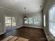 Bright dining area with sliding glass doors to the deck and multiple windows providing plenty of natural light at 179 Tomahawk Ln, Mount Gilead, NC 27371