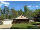 Charming single-story home with a welcoming porch and attached garage at 179 Tomahawk Ln, Mount Gilead, NC 27371