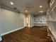 Spacious living room showcasing hardwood floors, built-in shelves, and recessed lighting at 179 Tomahawk Ln, Mount Gilead, NC 27371