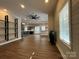 Open concept living room flows into kitchen featuring hardwood floors and recessed lighting at 179 Tomahawk Ln, Mount Gilead, NC 27371