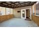 Covered back patio with convenient access to the home, featuring a smooth concrete surface at 179 Tomahawk Ln, Mount Gilead, NC 27371