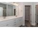 The primary bathroom offers double sinks, white cabinetry, and ample lighting at 184 Swann Rd # 1, Statesville, NC 28625