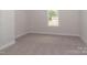Bedroom with carpet flooring, large window and neutral paint at 184 Swann Rd # 1, Statesville, NC 28625