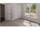Bedroom with carpet flooring, large window, and double door closet at 184 Swann Rd # 1, Statesville, NC 28625