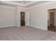 The primary bedroom offers ample space, neutral walls, and carpet flooring at 184 Swann Rd # 1, Statesville, NC 28625