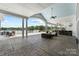 Spacious outdoor patio with comfortable seating, a ceiling fan, and views of the pool area at 2037 Mantle Ridge Dr, Indian Trail, NC 28079