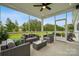 Screened patio with outdoor seating and a view of the landscaped backyard at 2037 Mantle Ridge Dr, Indian Trail, NC 28079