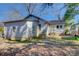 Side view of home exterior, including siding, yard and partially covered patio at 21 W D St, Newton, NC 28658