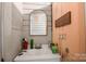 Bathroom featuring a sink and mirror, with off-white walls and vintage fixtures at 21 W D St, Newton, NC 28658