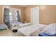 Bedroom showcasing two beds with a window, neutral walls, and vintage linoleum flooring at 21 W D St, Newton, NC 28658