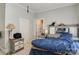 Bedroom with tile flooring, neutral walls, and a wooden dresser with a large mirror at 21 W D St, Newton, NC 28658