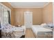 Bedroom with neutral walls featuring two beds, each with a neutral-toned mattress and bedding at 21 W D St, Newton, NC 28658