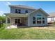 Fenced backyard featuring a covered patio and ample space for recreation at 2108 Sabra St, Gastonia, NC 28054