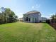 Large backyard with a covered patio, ideal for relaxation and outdoor activities at 2108 Sabra St, Gastonia, NC 28054