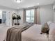 Well-lit bedroom featuring decor accents, a large window, and neutral walls at 2108 Sabra St, Gastonia, NC 28054
