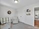 Comfortable Bedroom featuring a white armchair, closet, and decorative shelving at 2108 Sabra St, Gastonia, NC 28054