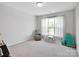 Bright bedroom with soft carpet and a window, creating a cozy and comfortable space at 2108 Sabra St, Gastonia, NC 28054