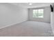 Spacious bonus room with neutral carpet, natural light, and modern ceiling fixture at 2108 Sabra St, Gastonia, NC 28054