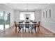 Bright dining room with wooden table set, chandelier, and sliding glass doors at 2108 Sabra St, Gastonia, NC 28054