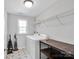 Bright laundry room features newer appliances and storage at 2108 Sabra St, Gastonia, NC 28054