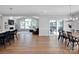 Bright open-concept living space with hardwood floors, a fireplace, and seamless flow between kitchen and dining at 2108 Sabra St, Gastonia, NC 28054