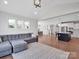 Inviting living room with a large sofa and an open view to the kitchen and dining area at 2108 Sabra St, Gastonia, NC 28054