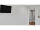 A modern flat screen television mounted on a painted wall with doorway in the background at 2108 Sabra St, Gastonia, NC 28054